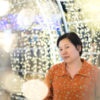 A woman surrounded by twinkle lights