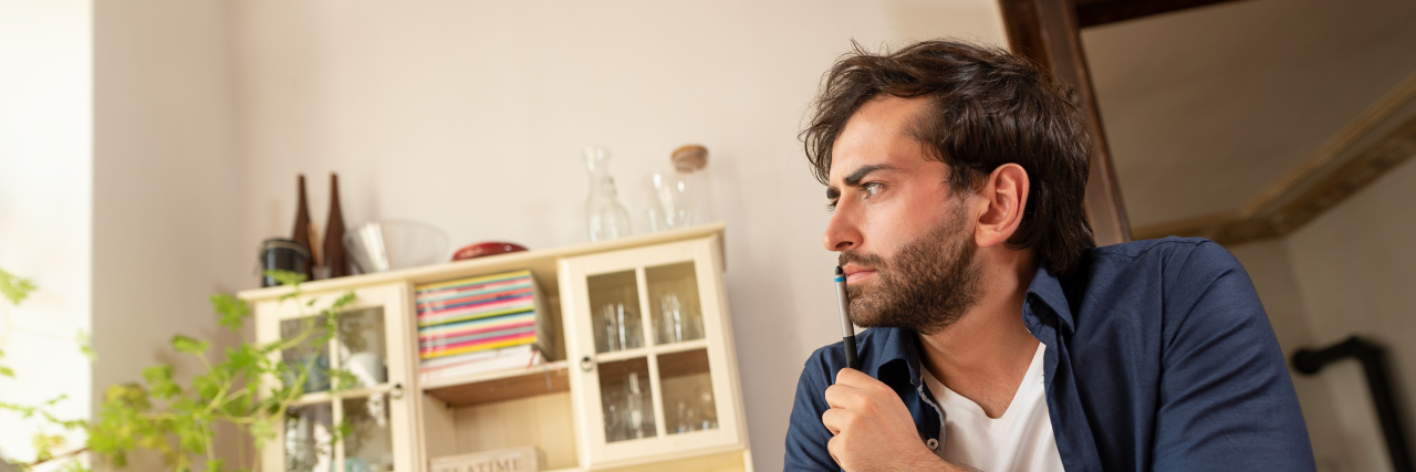 Being Judged Because of Disability Benefits When Dating Man thinking.