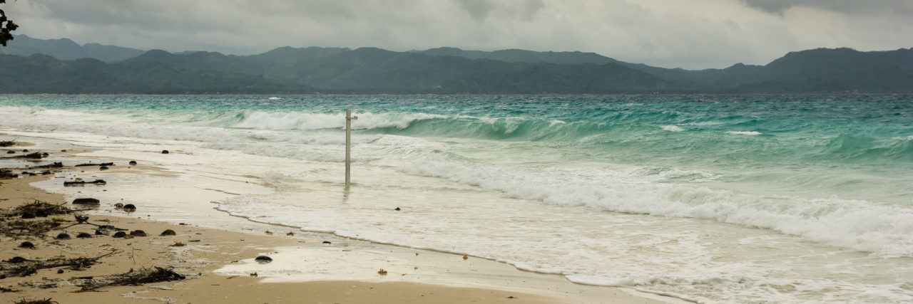 Tips for Surviving the Philippines' Habagat With Fibromyalgia Stormy seas batter a tropical beach during monsoon season