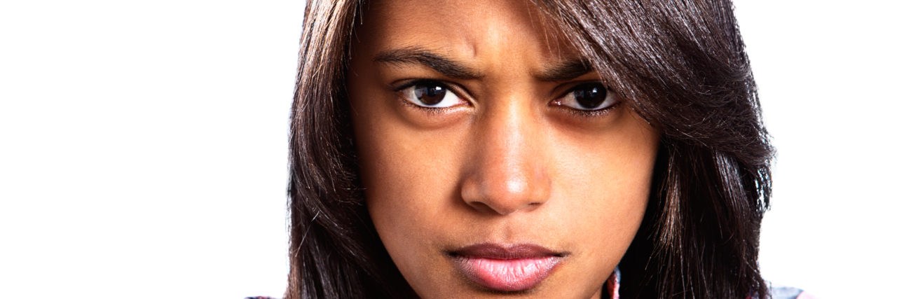 Anger Management and PTSD angry woman with black hair