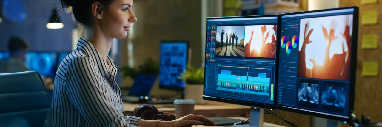 Improving Awareness and Support for Disabled Employees Woman editing videos.