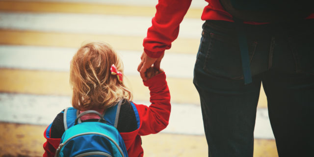 When a 'Friend' Judged Me for Getting Disability Benefits Mother walking daughter to school.