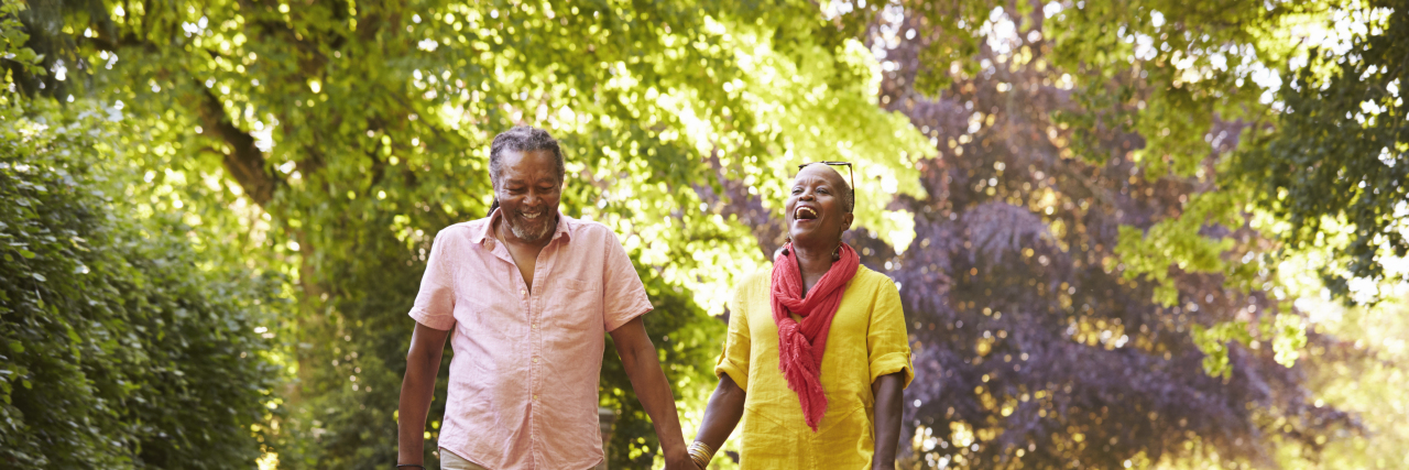 How Couples Therapy Is Like an 'Emotional Gym' Senior Couple Walking With Pet Bulldog In Countryside