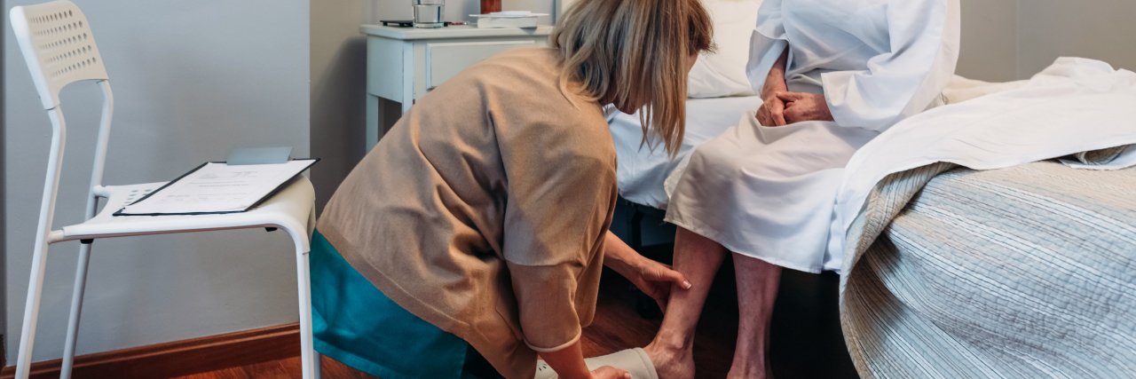 Home Care Provider Shortage in Ohio Leaves Disabled People At Risk Home care worker assisting elderly woman.