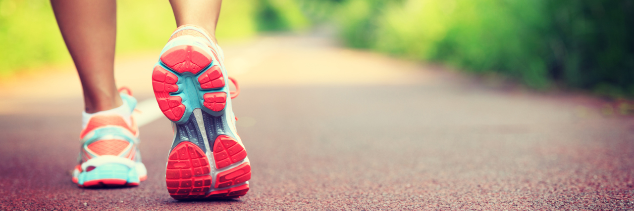 How Running Helped Me After Developing POTS and Fibromyalgia A person running on a trail