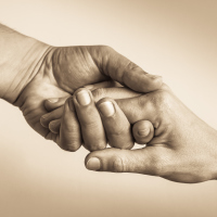 sepia photo of offering a helping hand
