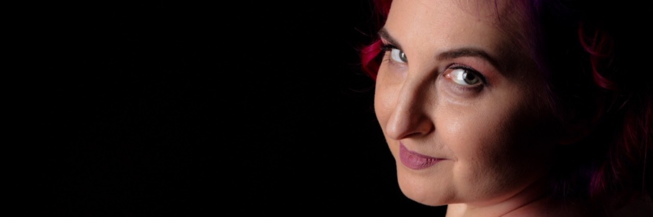 Disabled and Taking Sexy Back Jenny looking sensually towards the camera.