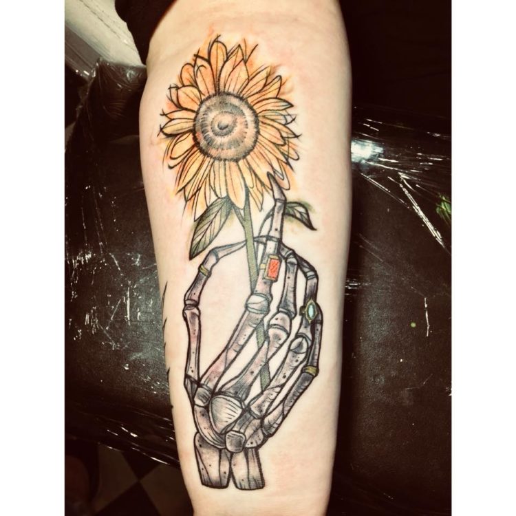 sunflower and skeleton hand tattoo