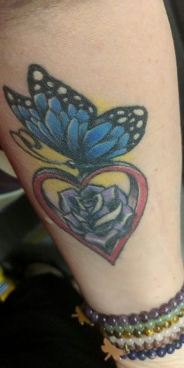 butterfly on heart tattoo