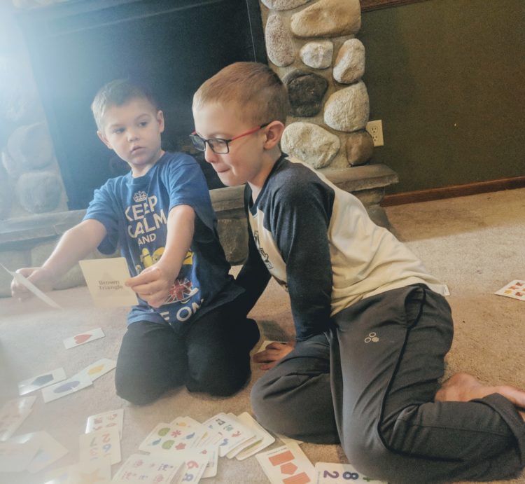 The author's two boys together playing cards