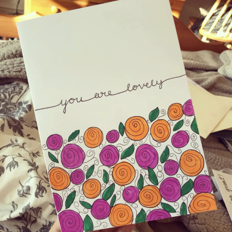 Card with orange and pink flowers that says "you are lovely"