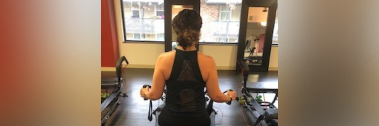 Exercising With Myasthenia Gravis woman working out at the gym