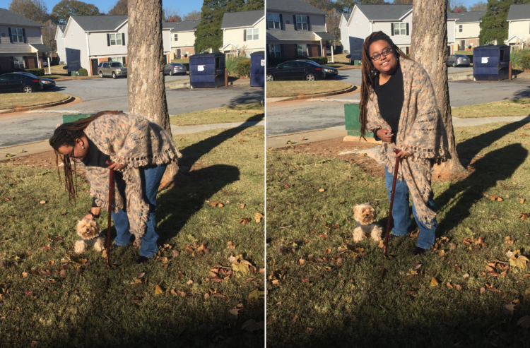 woman using a cane and standing outside next to her small dog