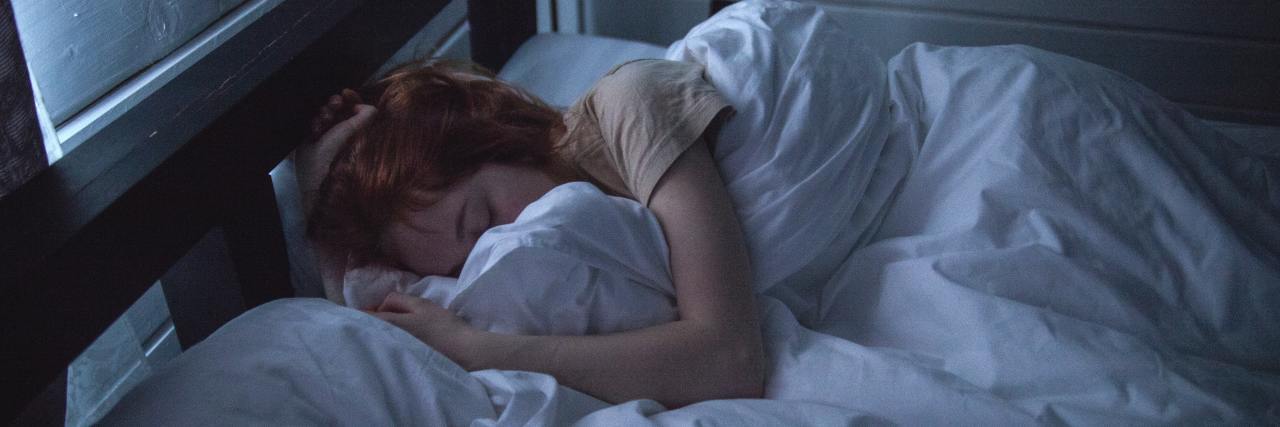 What It's Like Living in a Constant State of Pain woman sleeping in bed