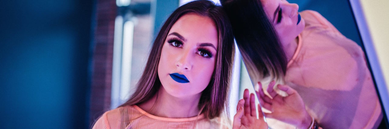 No, I'm Not Nervous — I'm Anxious. And Yes, There's a Difference. woman leaning against mirror