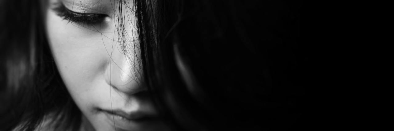 The Importance of Having a Good Doctor When You Have PCOS woman's face eyes looking down