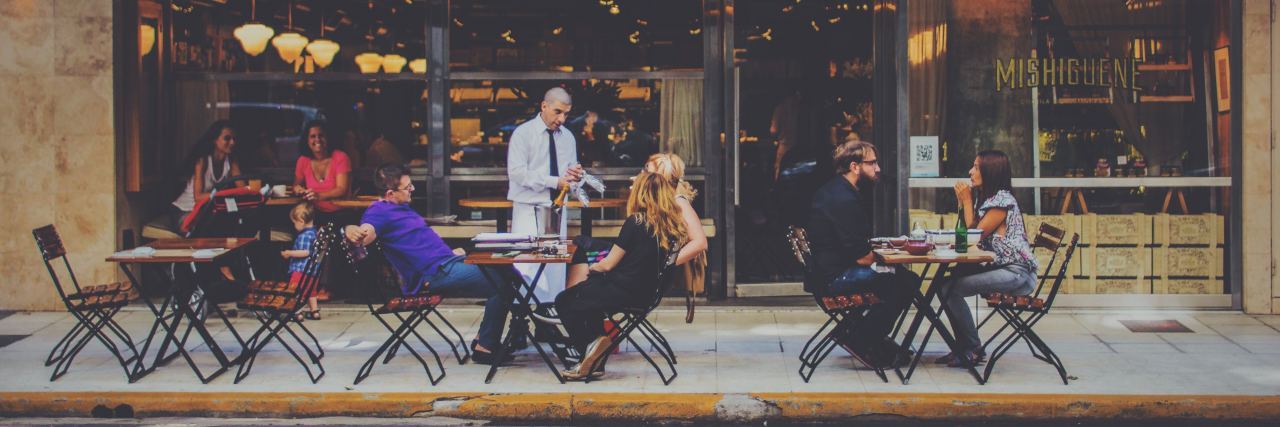 Tips for Eating at Restaurants When You Have Allergies, Anaphylaxis several tables out in front of a restaurant by the street