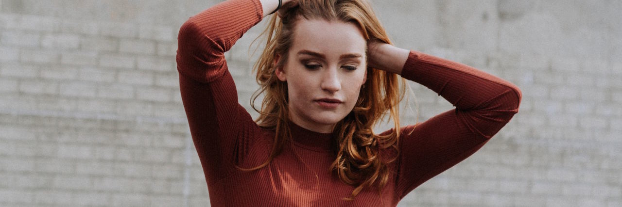 When I Mean When I Say 'I’m Fine' as Someone With Depression woman hands on head