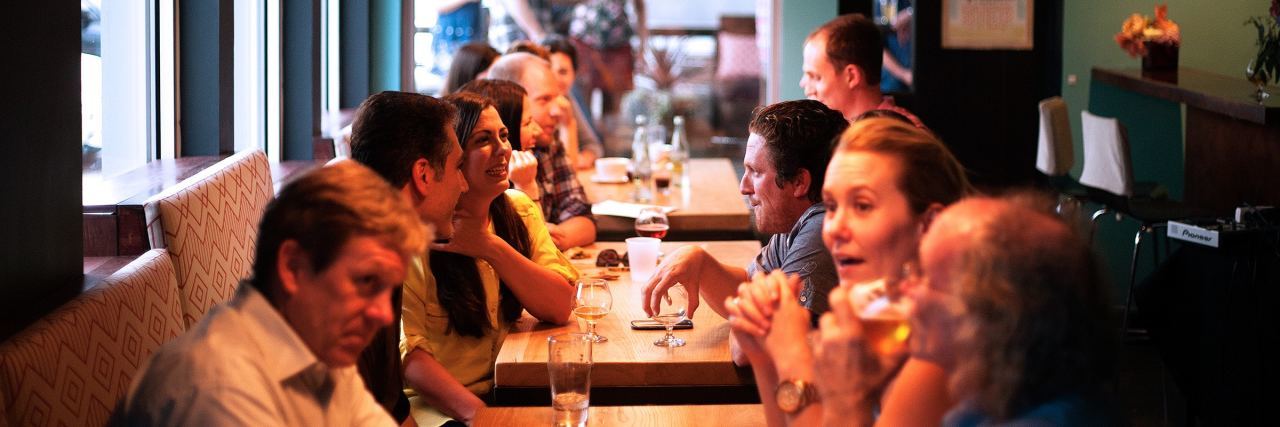 How to Cope With Office Party Anxiety image showing party at restaurant