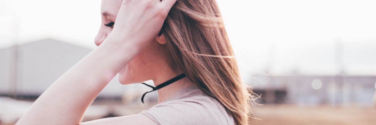 What Overthinking Everything Is Like woman with fingers in her blonde hair in profile