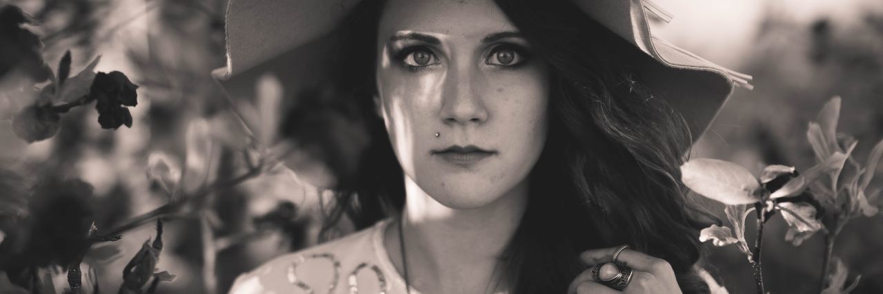 What If I Have Bipolar Disorder, Not Depression black and white photo of woman with dark hair and light clothes looking into camera