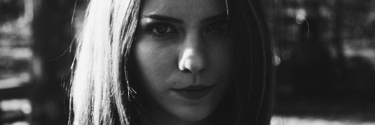 We Shouldn't Shame Holistic Treatments for Mental Illness woman looking at camera