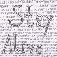 notepad with stay alive written in large letters and small affirmative statements written behind it.