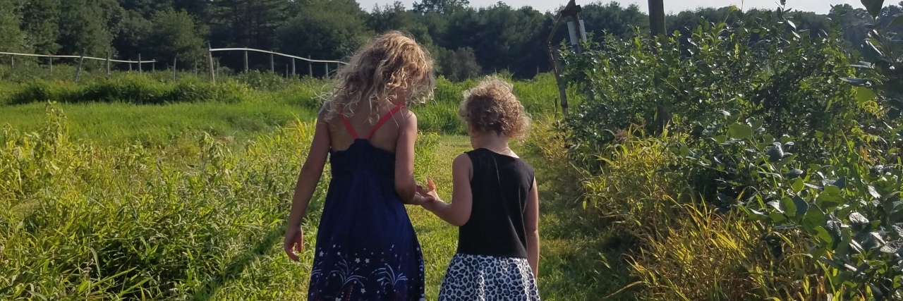 The Amazing Role Siblings Play in Disability Sisters walking hand in hand