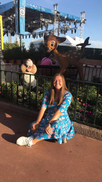 woman sitting on ground at disney world