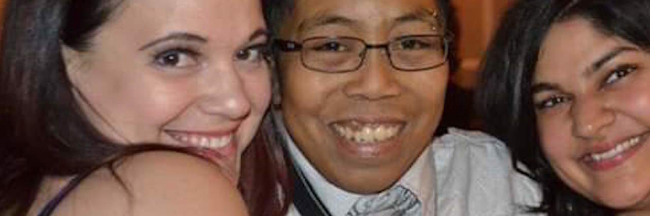Self-Care and Support With a Rare Blood Disorder The author in between his two friends, smiling
