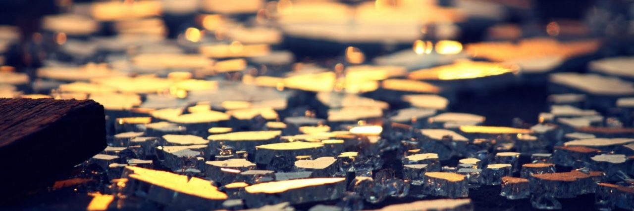 Breaking Stereotypes About Autism Reflected broken glass.