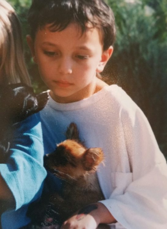 Image of a child holding a puppy
