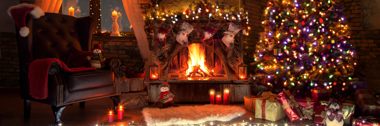 Managing Christmas With Cerebral Palsy Beautiful living room with fireplace decorated for Christmas.