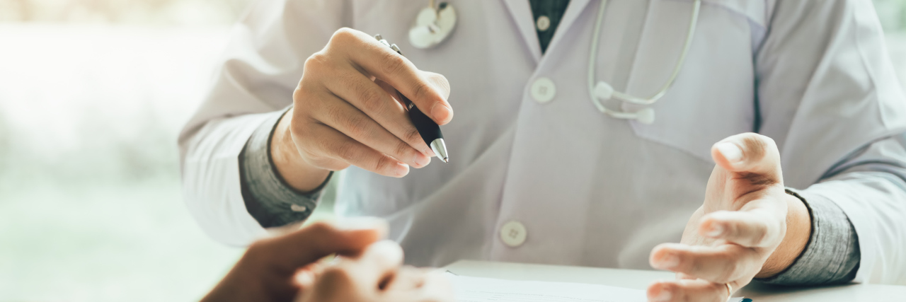 doctor talking with patient