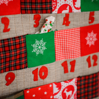 Christmas advent calendar with pockets on the wall.