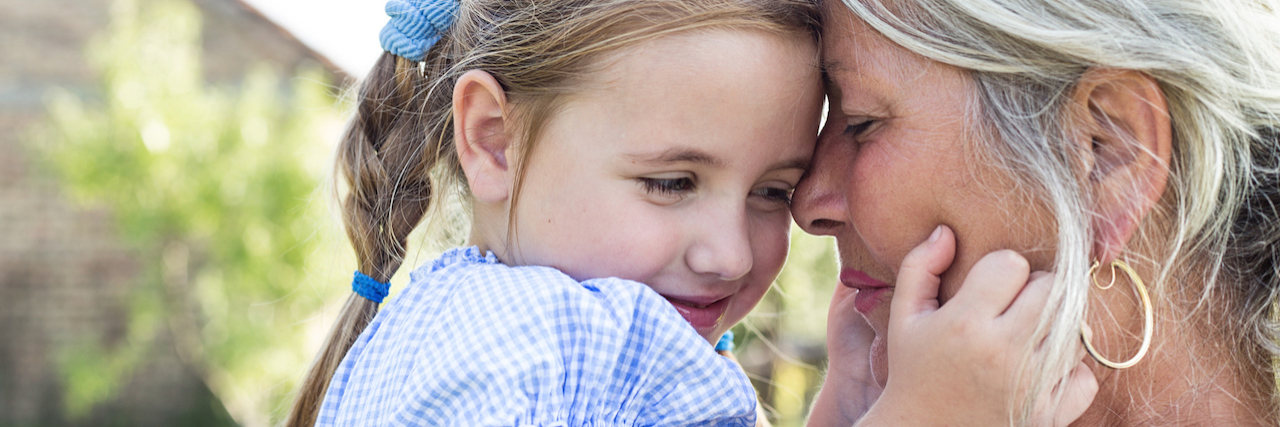 What I Wish I Said to a Grandmother With Bipolar Disorder An older woman holding a small girl, they're heads are close together