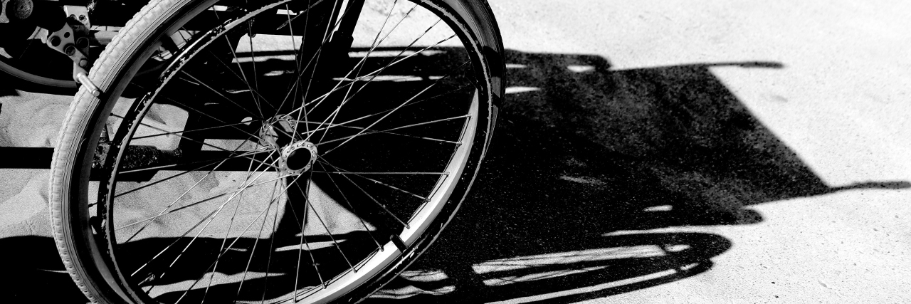 Shadow of wheelchair, black and white photo.