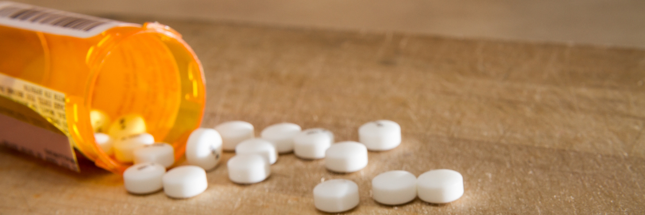 JAMA Study Says Opioids Don't Work Well for Chronic Pain. Now What? White pills spilled out over some wood
