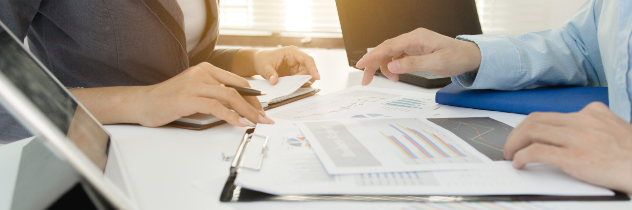 Dealing With an Abusive Vocational Rehabilitation Counselor Man and woman looking at papers.