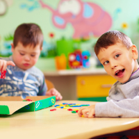 Two kids in a special education classroom.