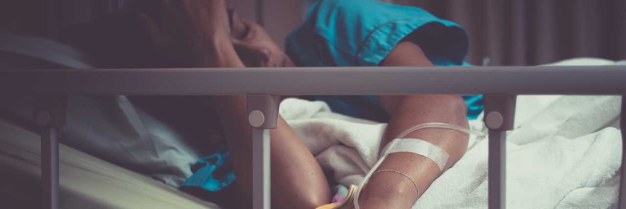 Healing From Guillain-Barre Syndrome Woman lying in bed in hospital.