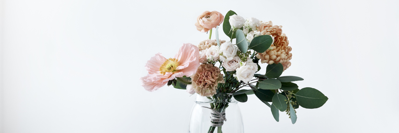 Having a Hysterectomy Due to Adenomyosis Does Not Affect My Womanhood vase of flowers