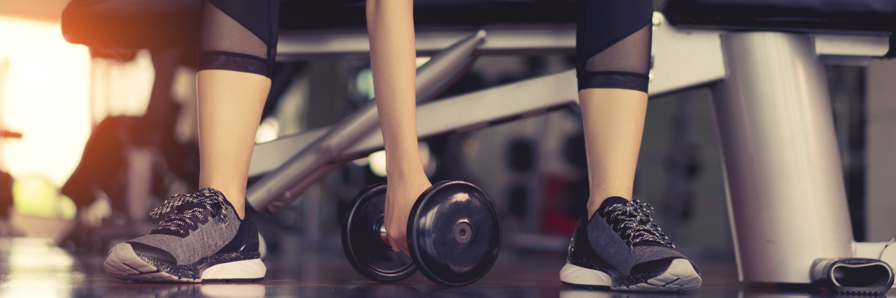 How 'Fitness Culture' Promotes Harmful Disability Stereotypes Woman working out.