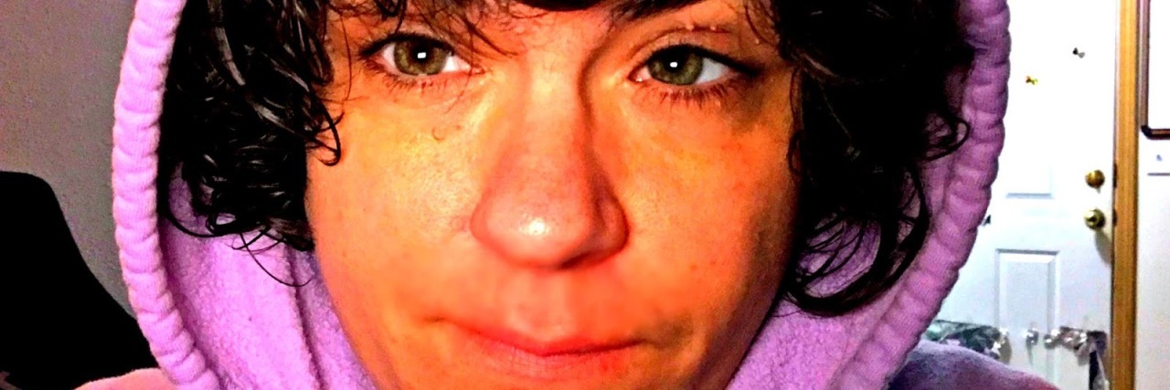 When People Say 'You Don't Seem Autistic' Angel wearing a pink hoodie.
