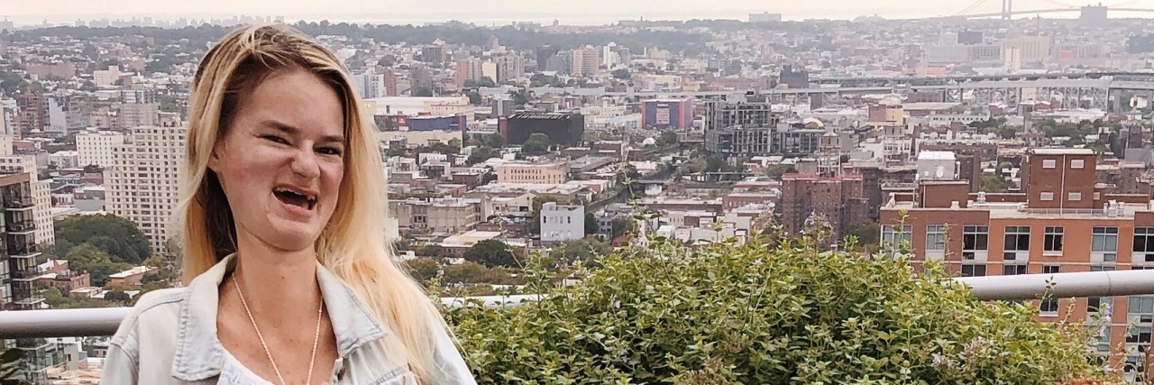 There Is Life After Having a Stroke Courtney sitting outdoors on a balcony.