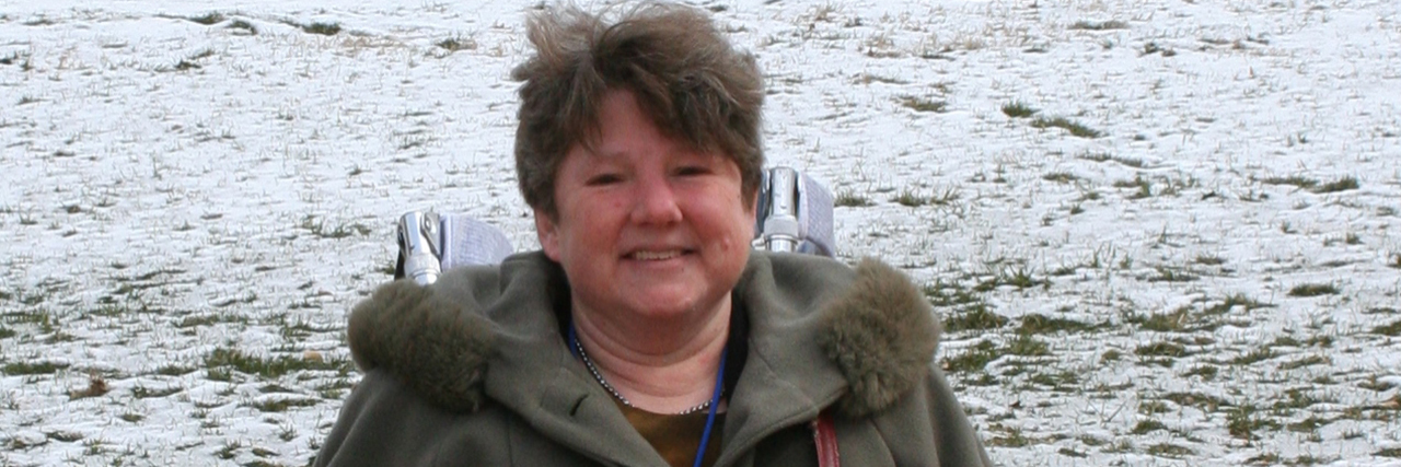 Insurance Companies Use Medicare Guidelines to Deny Wheelchairs Lynne out in the snow with her wheelchair.