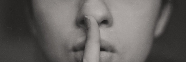 A woman putting her fingers to her lips. Text reads: 9 'white lies' people with anxiety tell