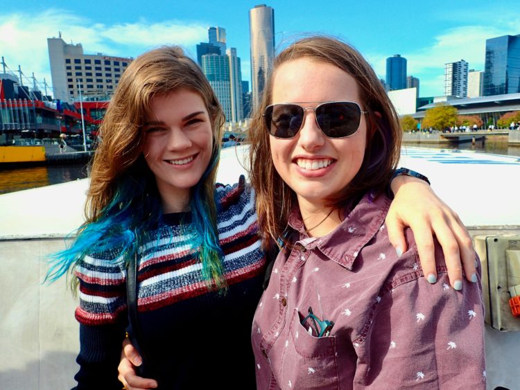 the author and her partner smiling outside in Melbourne