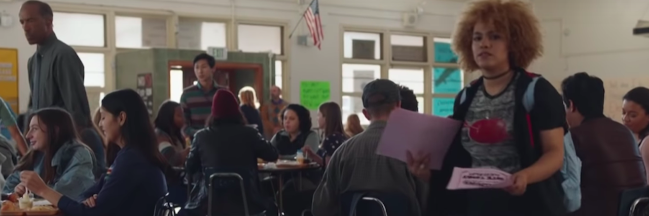 What to Know About the New Sandy Hook Promise PSA View from a lunch table at a school cafeteria. Students are eating lunch