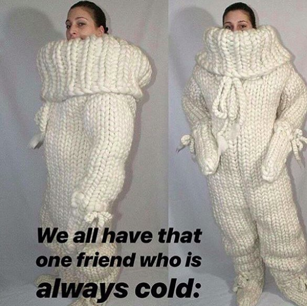we all have that one friend who is always cold: woman dressed in sweater onesie